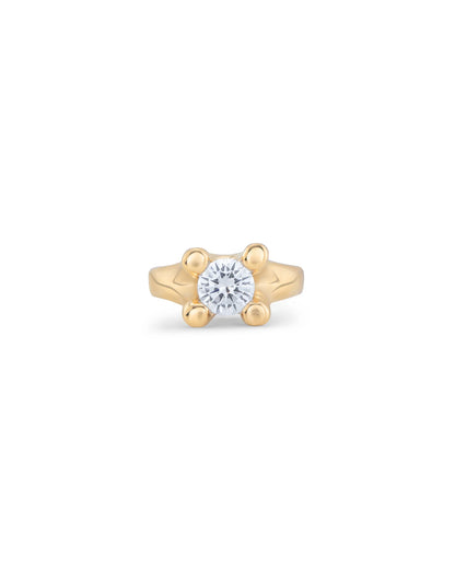 Gold ring with round, clear cubic zirconia in a four-prong setting. Available in multiple sizes.