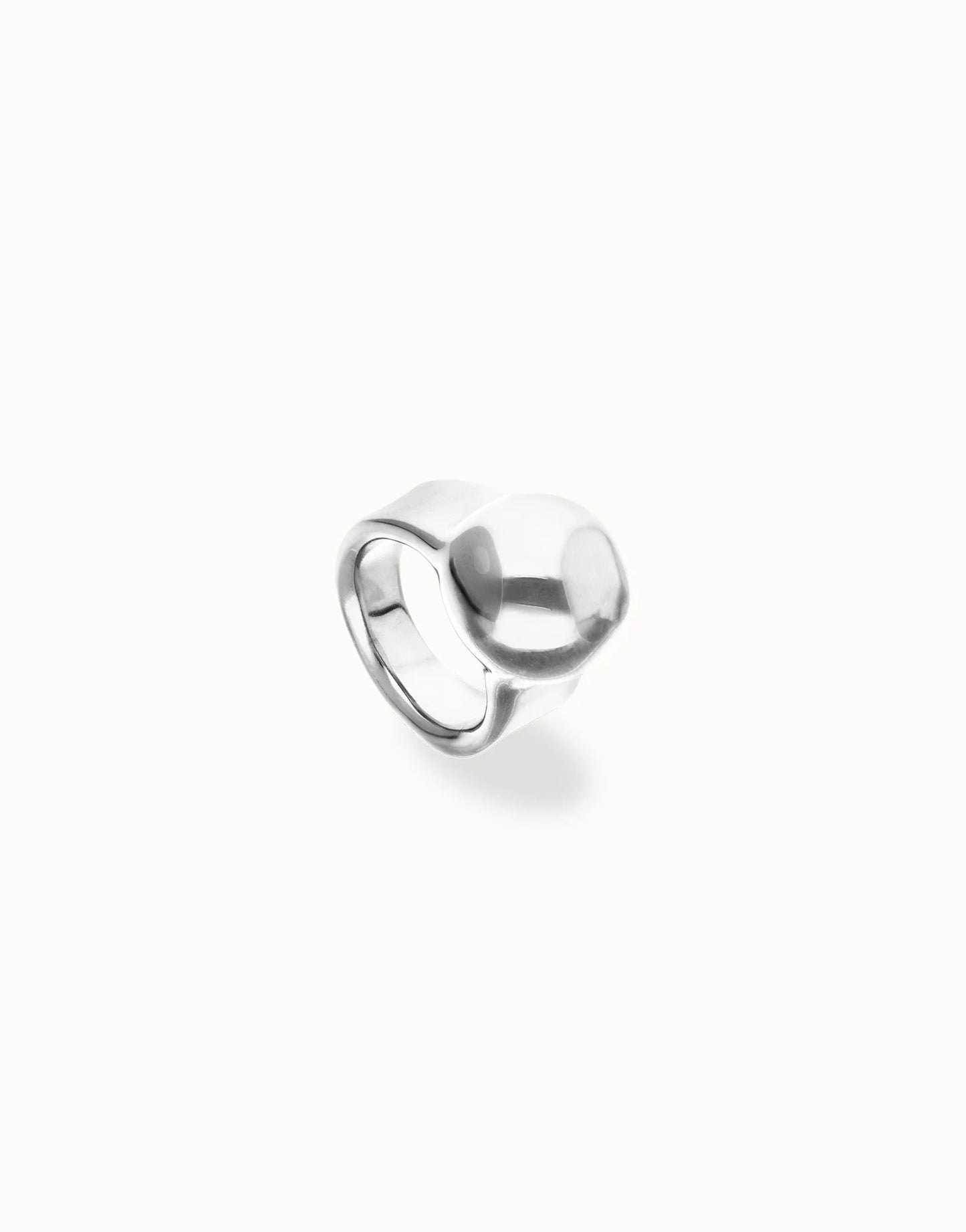 Chunky sterling silver ring with a smooth, asymmetrical sphere-shaped top; available in sizes 6, 7, and 8.