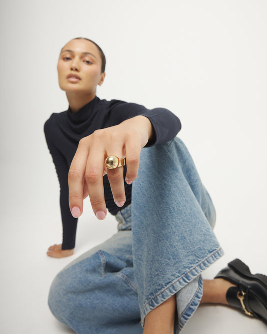 18k gold ring with a polished sphere design; available in sizes 5-9.
