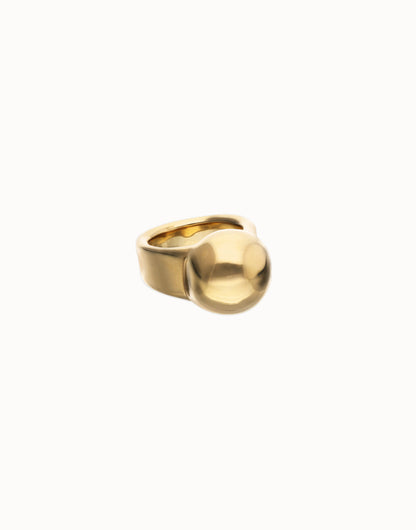 18k gold ring with a wide band and oversized smooth dome; available in sizes 5-9.
