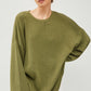 This product, The Augusta Sweater, is a unique piece that features wide sleeves and a visible seam down the front, making it both stylish and comfortable. It's a versatile item that can be dressed up or down for any occasion. This sweater is available in a range of sizes to fit various body types. The available sizes are small, medium, large, and extra-large.