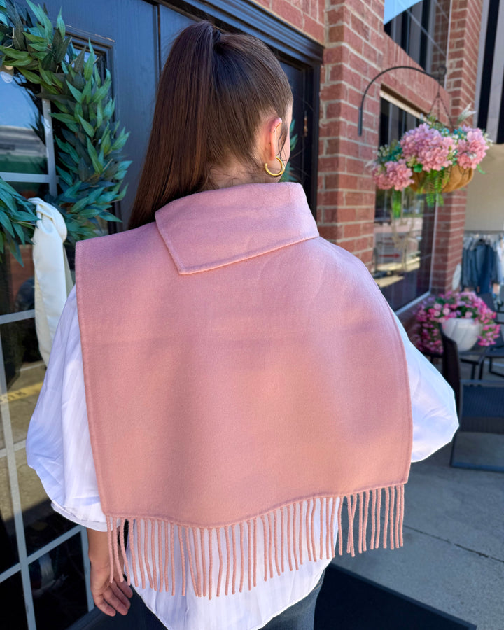 Blush Collar Poncho with Fringe in blush pink featuring a folded collar and fringed hem, available in all sizes.
