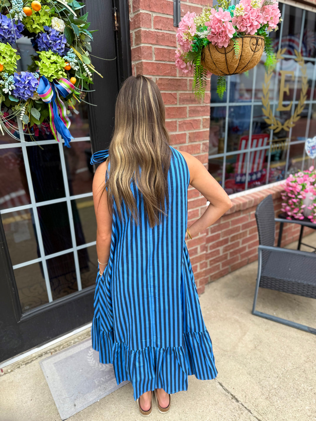 Navy Stripe Tie-Neck Midi Dress, available in sizes XS-XL. Features tie neckline and striped pattern.