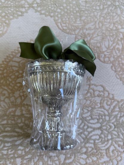 Silver urn-shaped French Bee Candle, in clear plastic wrap with green satin ribbon; available in multiple sizes.