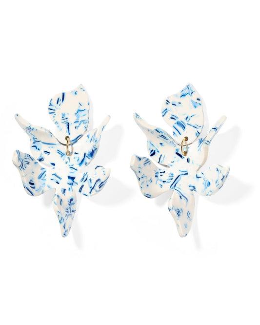 White floral statement earrings with blue speckles and gold centers. Available sizes: small, medium, large.