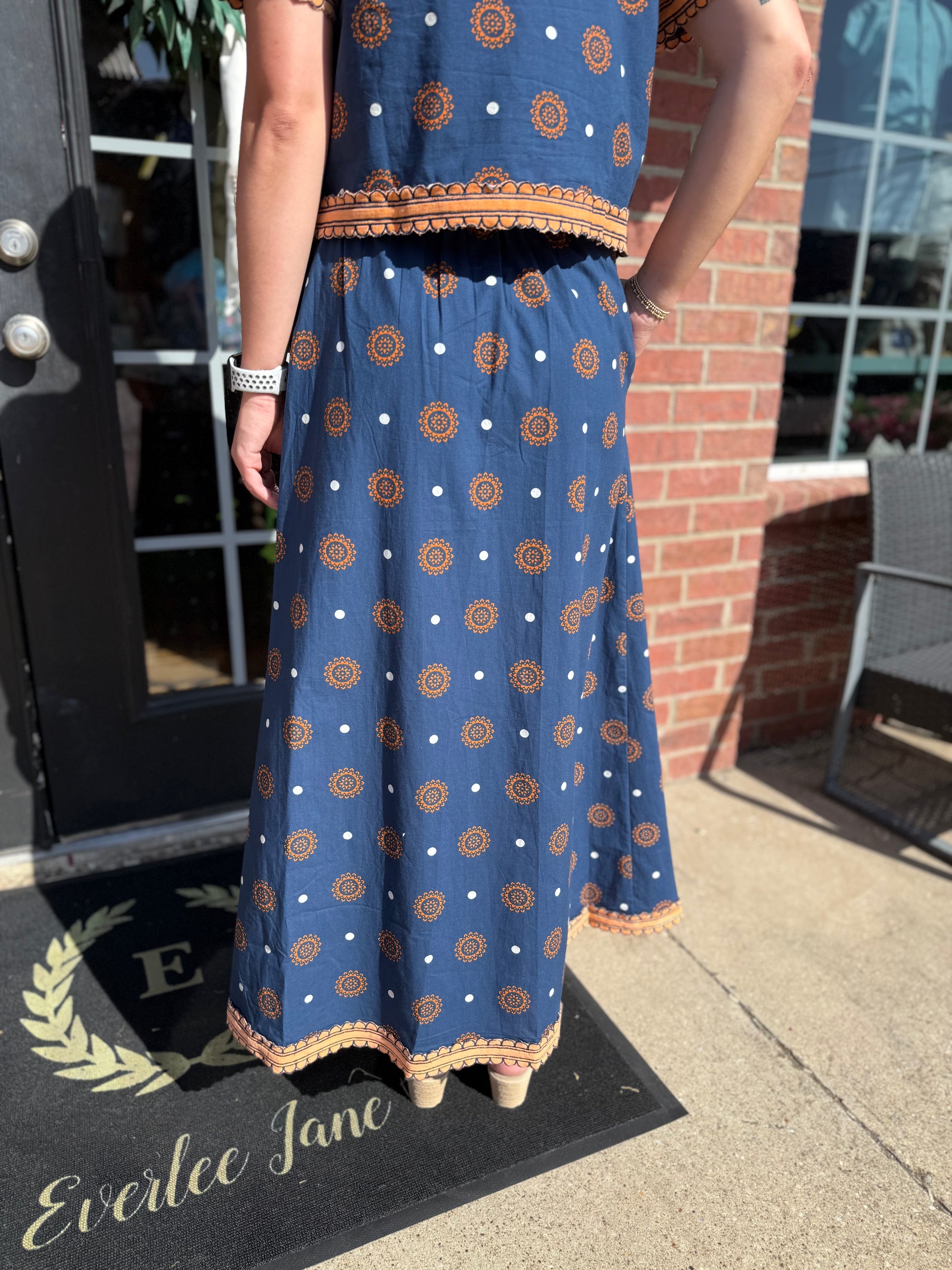 Auburn Medallion Skirt Set: blue with orange geometric patterns and white polka dots, hand block printed. Available in sizes XS-XL.