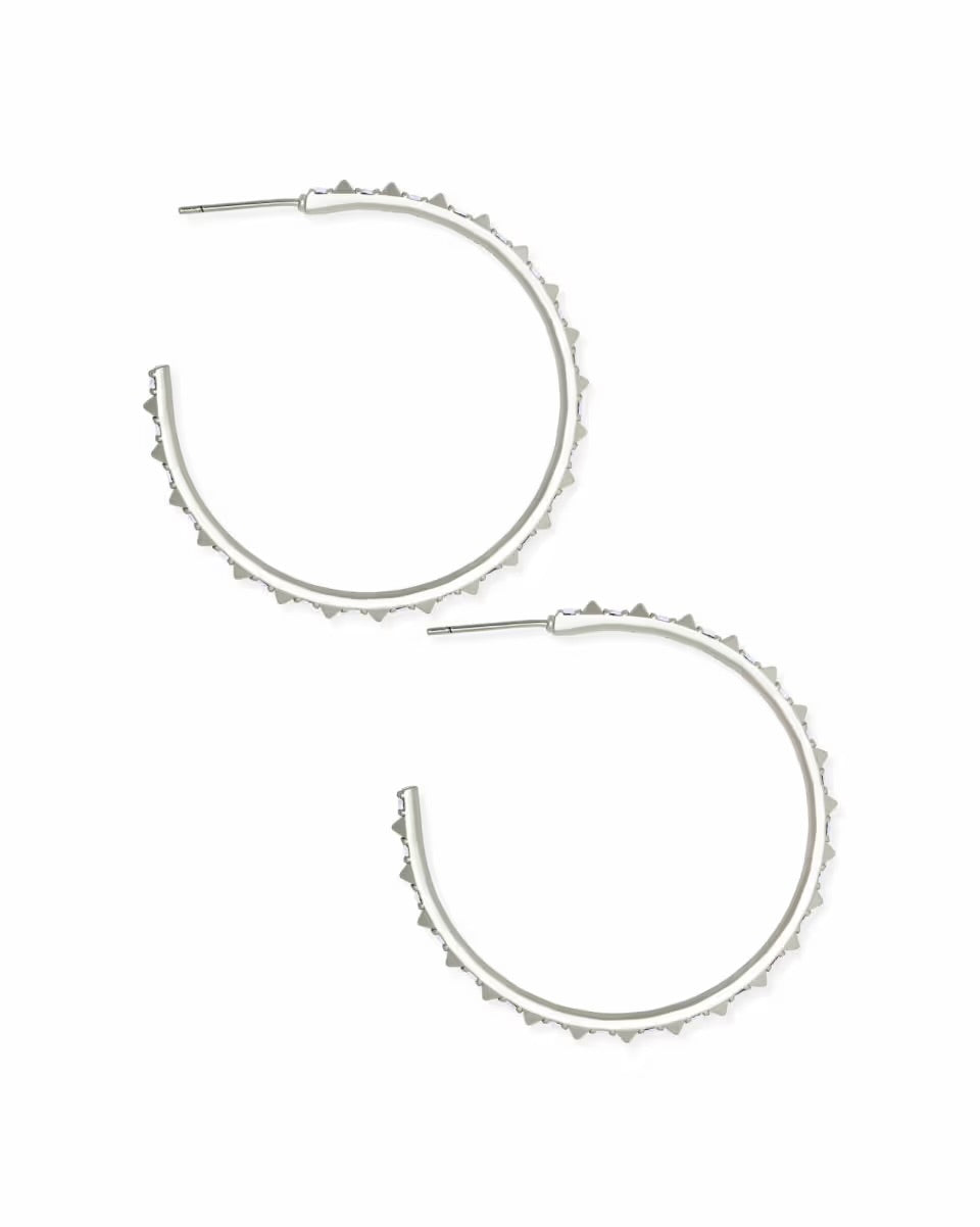 Large silver hoop earrings with iridescent crystals and textured spiked edges. Available in one size.