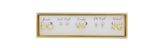 Set of five pairs of gold-tone Twist Huggie with Crystal Hoop earrings. Includes varying designs for Brunch, Gala Night, Everyday, Date Night, and Weekend. Elegantly arranged in a white and gold box. Available sizes: small hoops to intricate shapes.