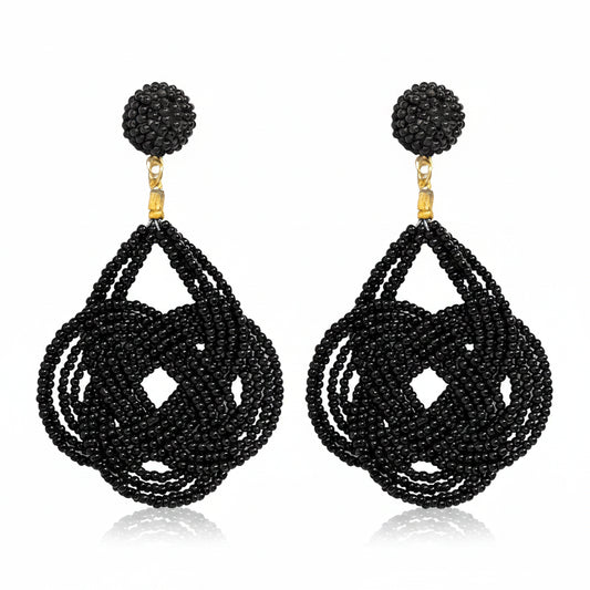 Whit Black Beaded Statement Dangle Earrings with circular tops, knotted teardrop shapes, and gold accents; available in small, medium, and large sizes.