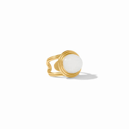 Gold ring with wide band and large round white jade stone in raised bezel. Available in sizes 5-9.