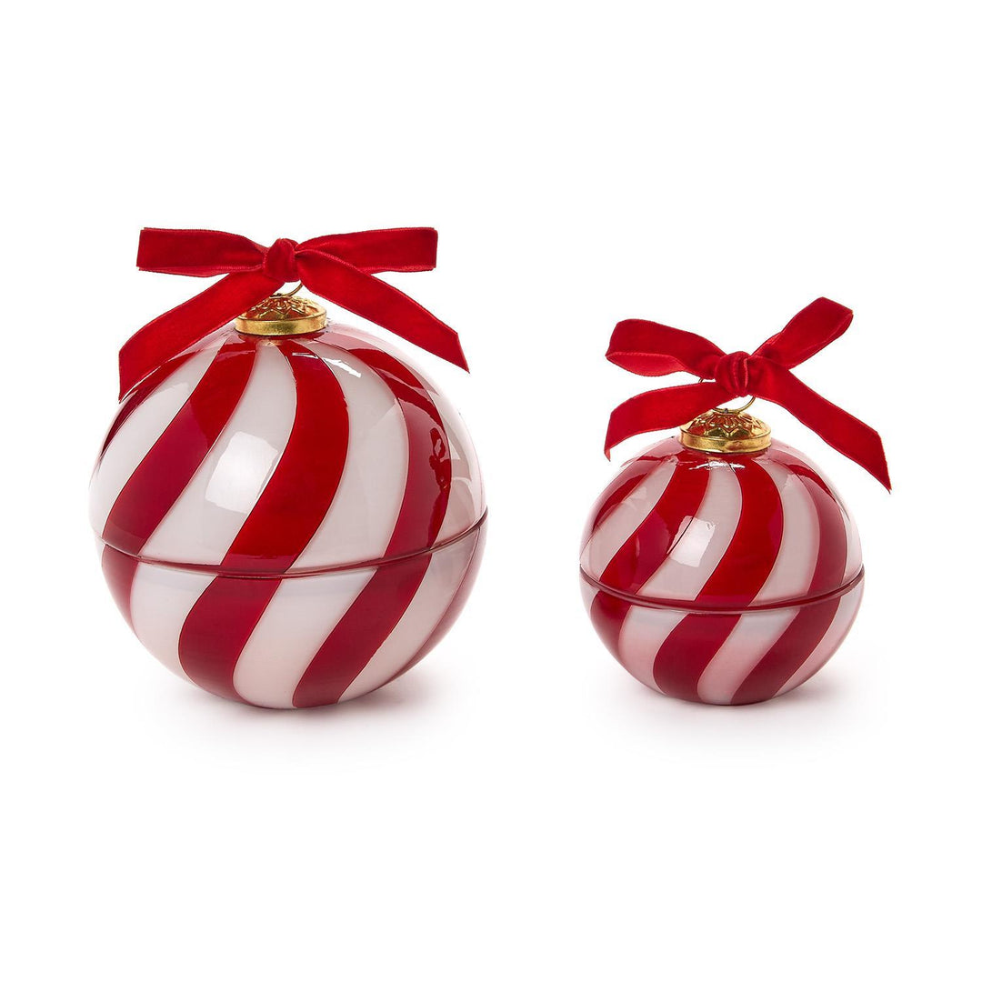 Large and small Sugar Cookie Ornament candles, round with red and white stripes and red bows.