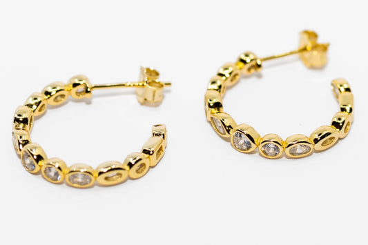 Tango Gold Earrings in 18K gold with round clear gemstones set on front. Available sizes: small, medium, large.