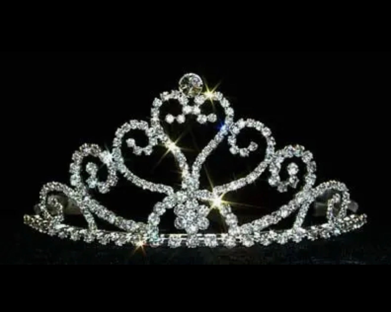 Tall Heart Tiara in sterling silver with swirling designs and sparkling diamonds. Available in small, medium, and large sizes.