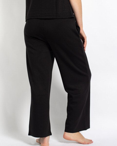 Taylor Pants: black, relaxed, straight-leg lounge pants with a drawstring waistband. Available in sizes S-XL.