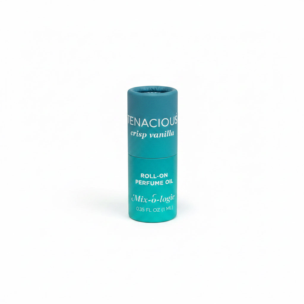 Small teal cylinder labeled "Tenacious crisp vanilla," Mix-o-logie Keychain Mini Rollerball Perfume, 0.35 FL OZ (11mL), alcohol-free.
