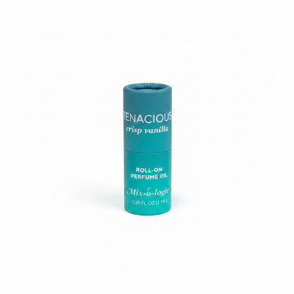 Small teal cylinder labeled "Tenacious crisp vanilla," Mix-o-logie Keychain Mini Rollerball Perfume, 0.35 FL OZ (11mL), alcohol-free.