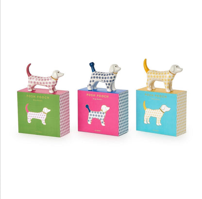 The Posh Pooch Dog Ceramic Ring Holder, available in a boxed set of three colors—pink, blue, and teal—with unique dog illustrations. Sizes available are not specified.