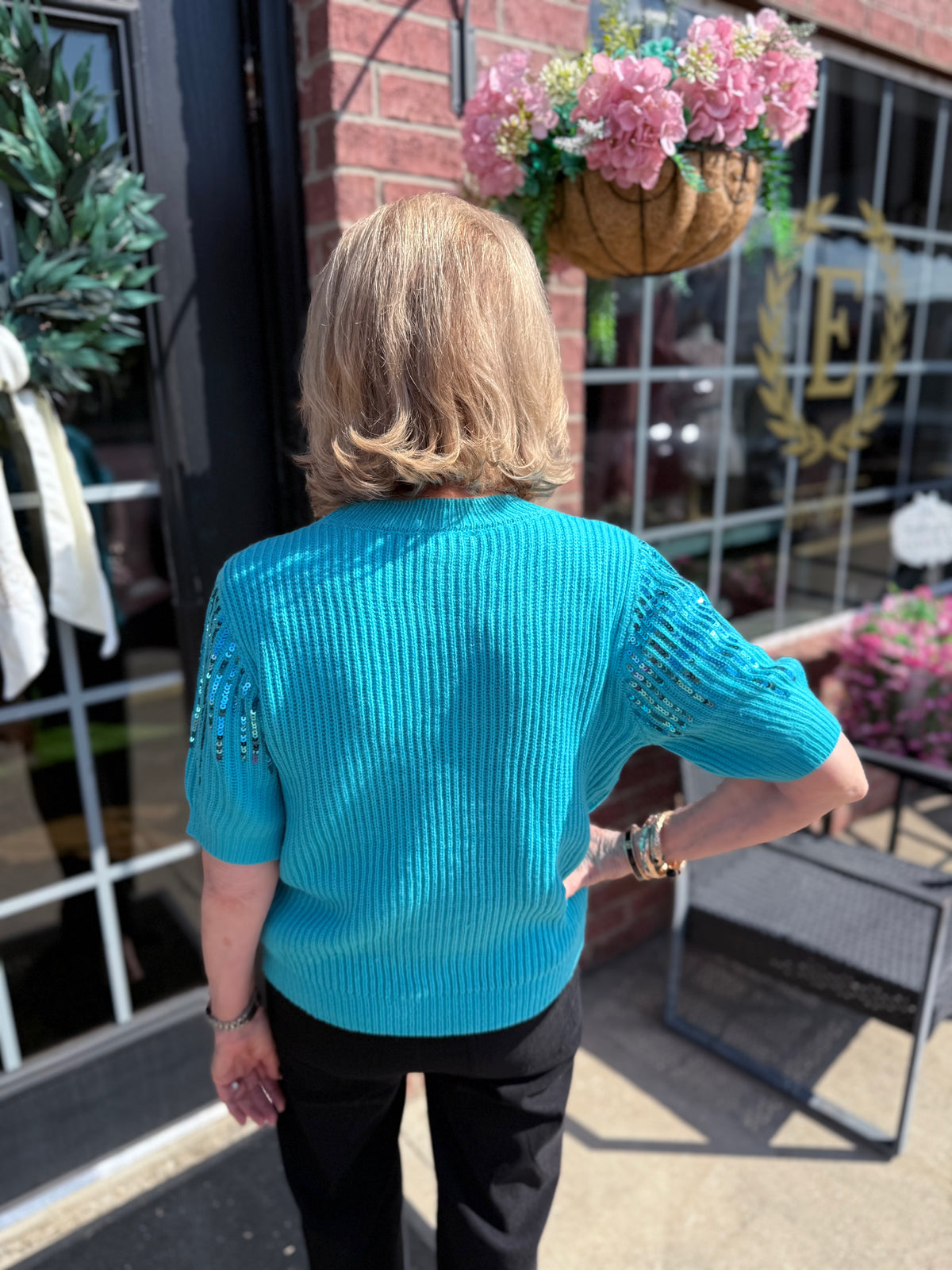 Colette Sequin Sweater in teal; available in sizes XS-XL.