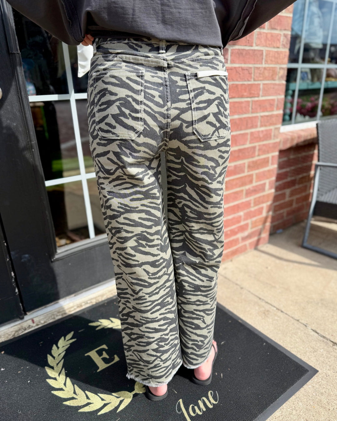 Zebra Print Wide-Leg Jean with high-rise waist; available in sizes 24–32.