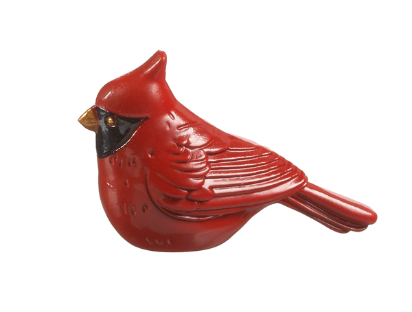 Small red cardinal figurine charm with a black face mask and gold beak.