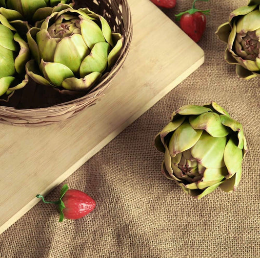 Faux Artichoke Decor available in small, medium, and large sizes; displayed in a basket and on a wooden board.