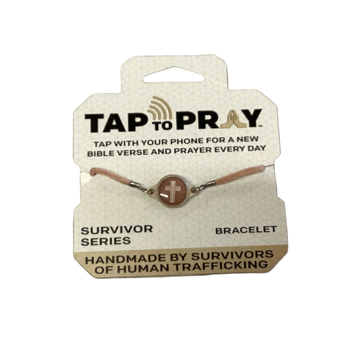 Tap To Pray Bracelet with a round cross charm, handmade by survivors.