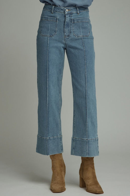 Straight Leg Denim in high-rise blue wash with front pockets and pronounced front seam detail. Available in sizes 24–32.