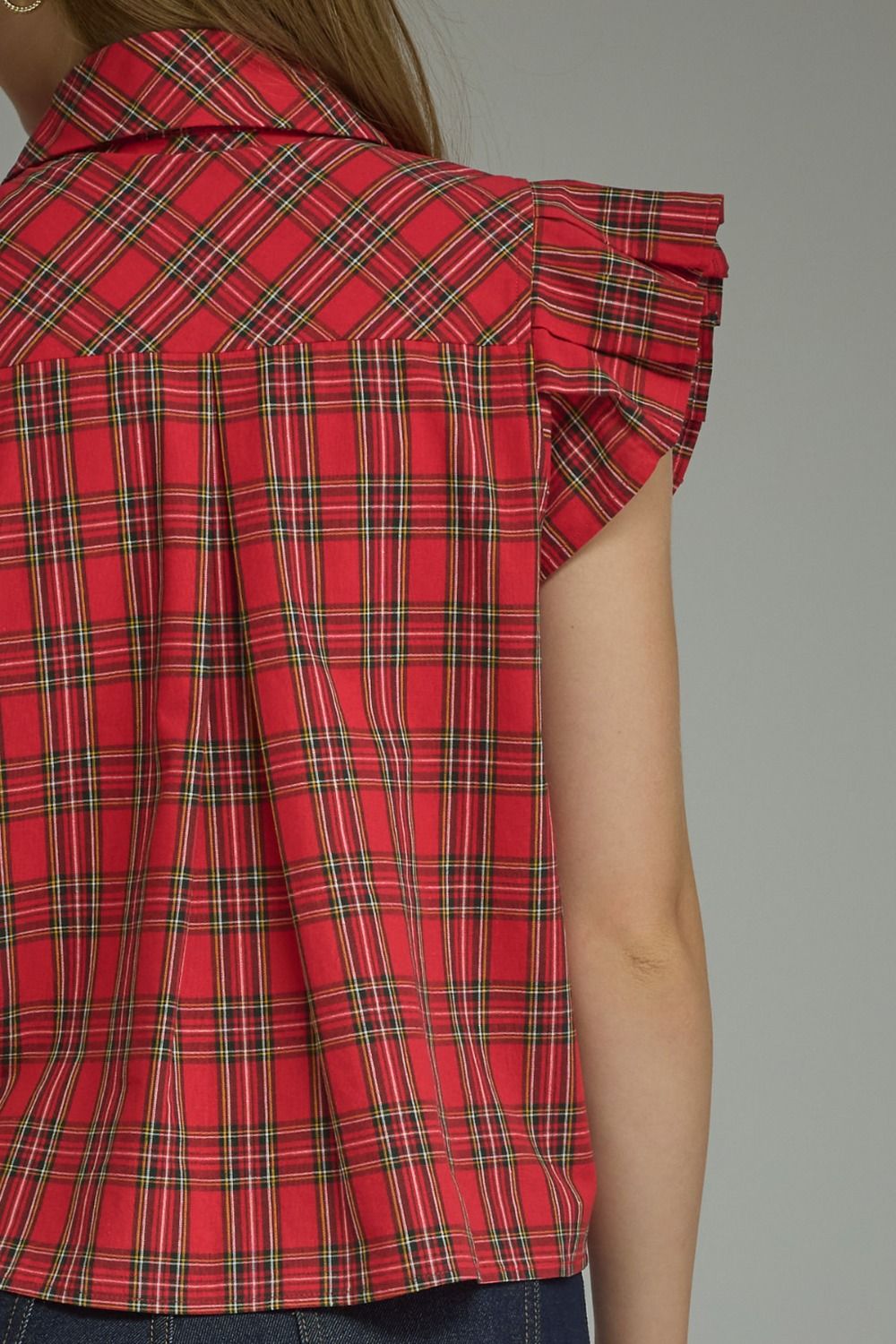 Red Plaid Ruffle Blouse with ruffled shoulders, available in sizes XS–XL.