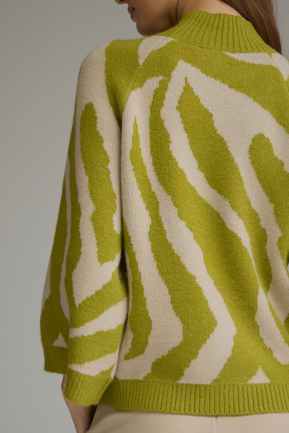 Lime green and beige zebra print mock neck sweater. Available in all sizes.