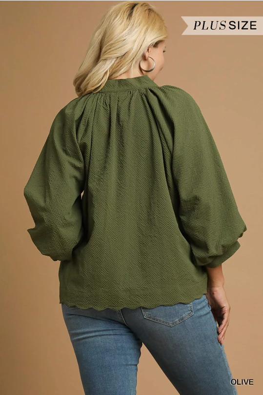 PLUS SIZE olive green textured blouse with scalloped hem, puffy sleeves. Available in sizes 1X-4X.