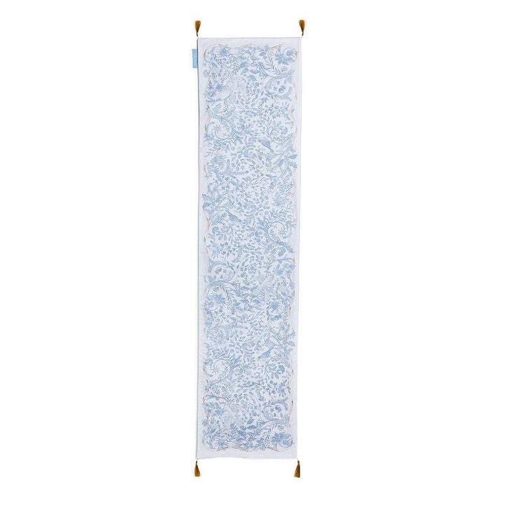 Gilded Cottage Double-Sided Table Runner with a rectangular blue and white floral toile pattern, gold border, and corner tassels.