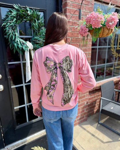Tree Camo Bow Long Sleeve: pink cotton shirt with large tree camo bow design on back. Available in sizes S-XXL.