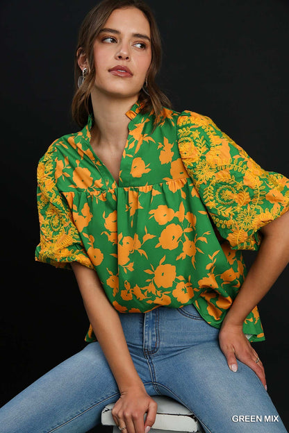 Green Mix Top with Embroidery Sleeves: A green blouse with yellow floral patterns and intricate designs. Sizes available: S, M, L, XL.