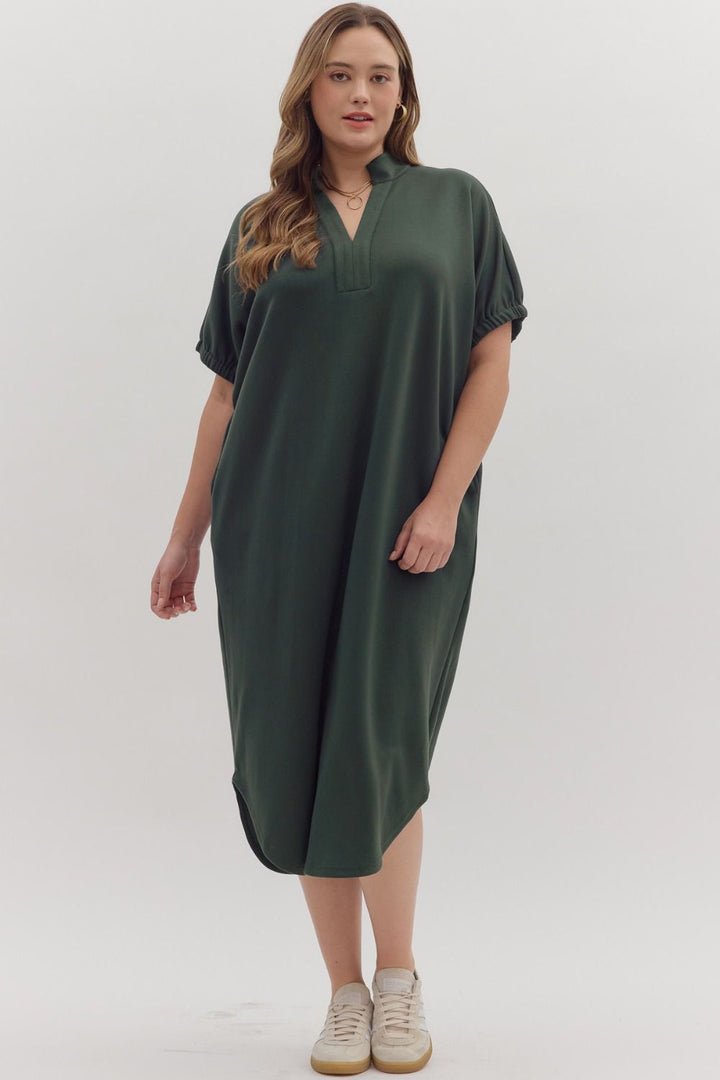 Collie Midi Dress in dark green, V-neck, band collar, midi length, short elasticized sleeves, lightweight knit. Available in all sizes.