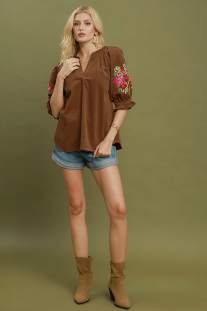 Embroidered Sleeve Corduroy Blouse with floral sleeve detailing. Available in sizes XS-XL.