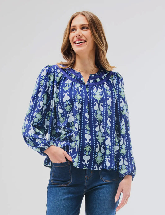 Janelle Top Ikat Stripe with notched neckline and crochet lace trim. Available in sizes XS-XL.