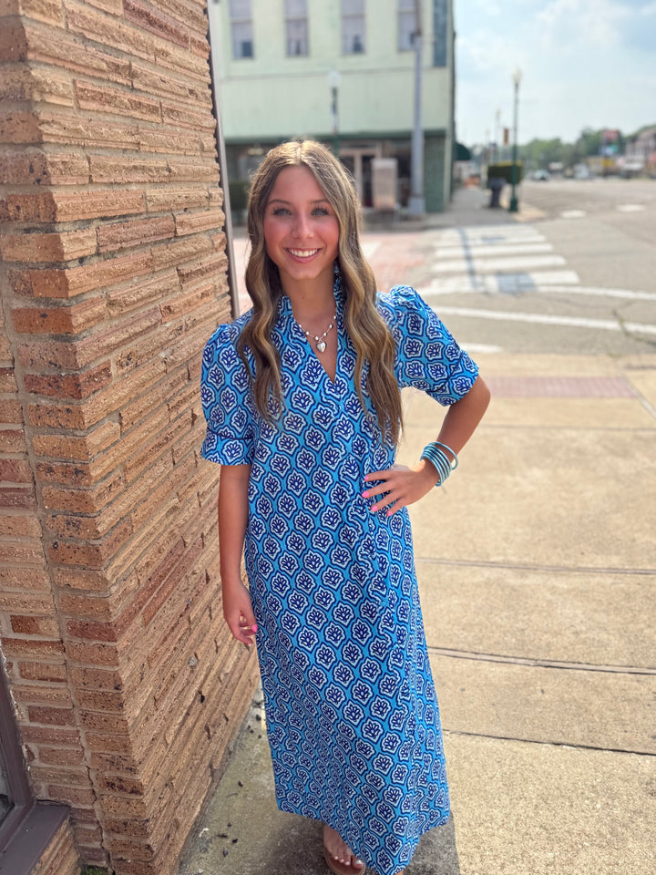 Bright Blue Printed Button Down Midi Dress, available in sizes XS-XL. Features allover print and front button closure.