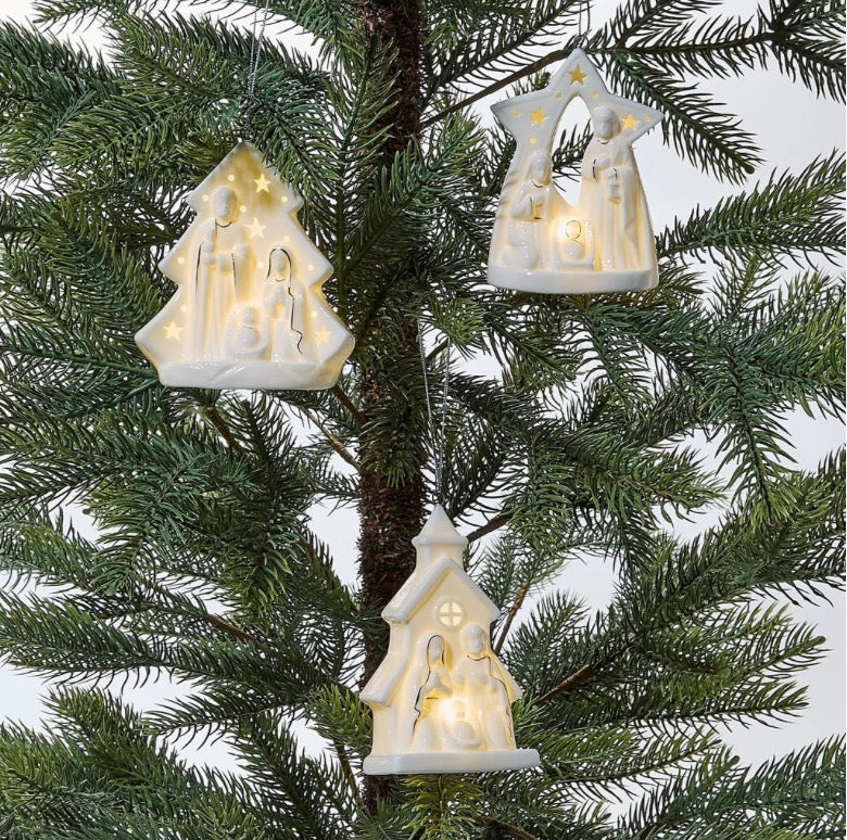Starry Manger Light-Up Keepsake Ornaments in white tree, archway, and church shapes.