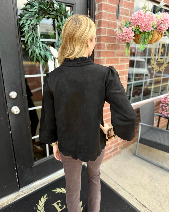 Sienna Scallop Top features black scalloped edges and a ruffled neckline. Available in sizes XS–XL.