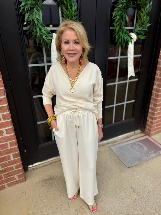 Hazel Ivory Top in ivory, available in sizes XS-XL.