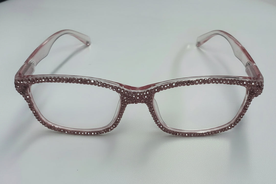 Clear rectangular eyeglasses with pink rhinestones on front and arms. Available sizes: small, medium, large.
