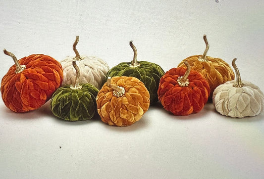 A festive cluster of Braided Velvet Pumpkins: warm hues of orange, green, mustard yellow, and off-white; charming stem tops. Sizes available: small, medium, large.