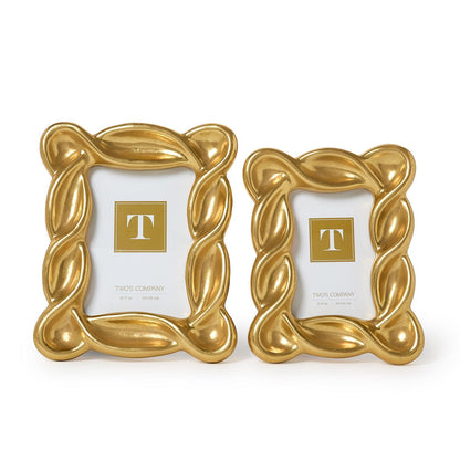 Two Infinity Gold Leaf Frames with a wavy, braided gold design; available in two sizes.