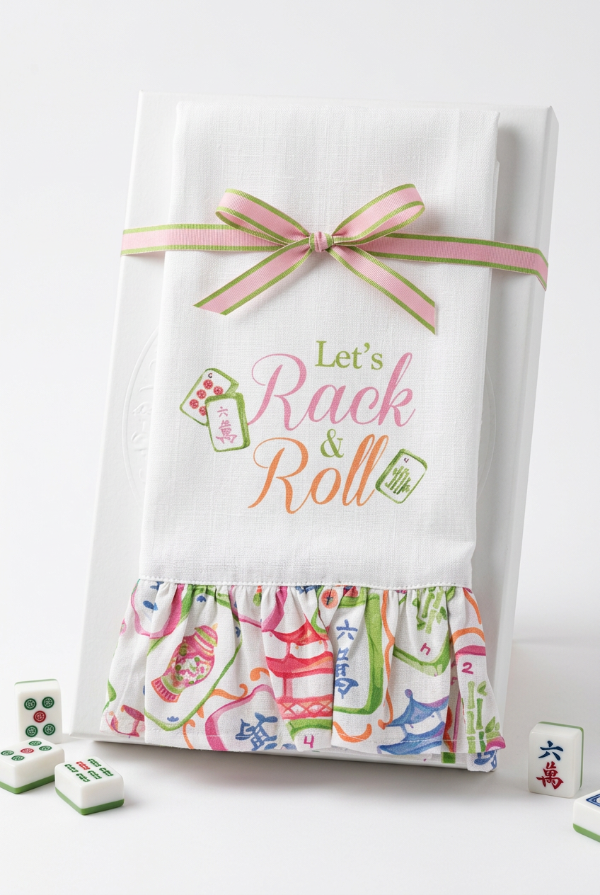 Rack & Roll Ruffled Hand Towel, white ruffled towel with “Let’s Rack & Roll” text and green and pink ribbon.