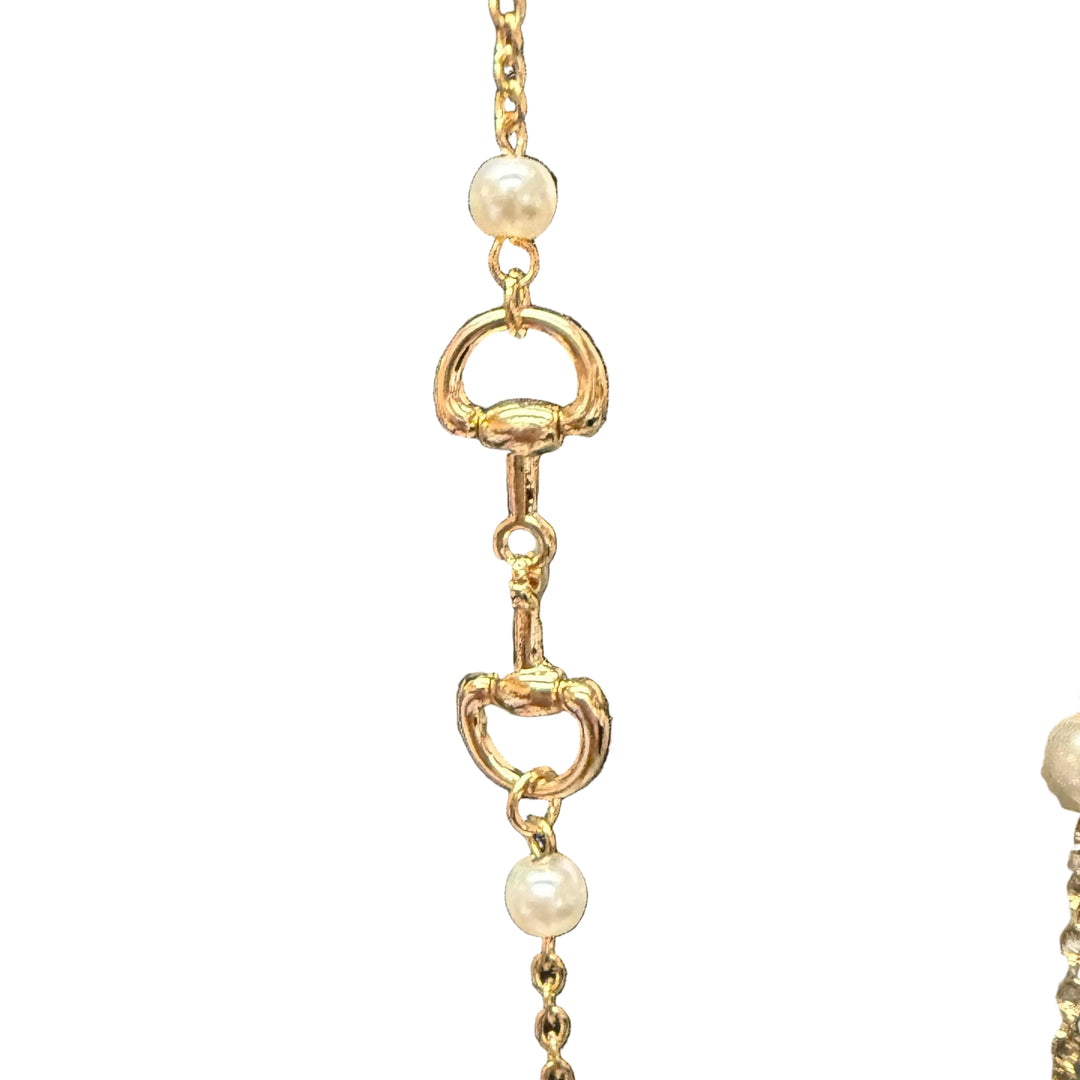 Candy Gold Pearl Necklace with delicate white pearls and gold horse-bit accents. Available in 16", 18", and 20" lengths.