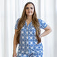 The Palace Tile Sleep Top from the Royal Standard collection is blue and white in color. Available sizes for this product range from small to extra-large.