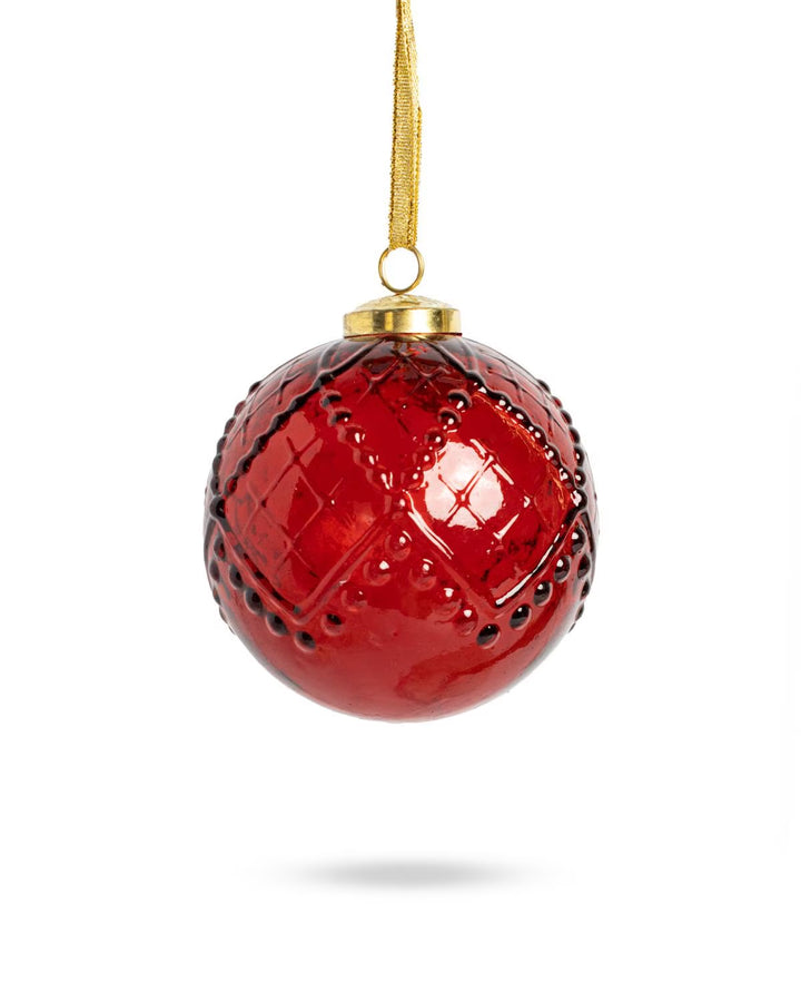 Hudson Ornament | Red: a round, textured grid-pattern ornament with a gold cap and ribbon.