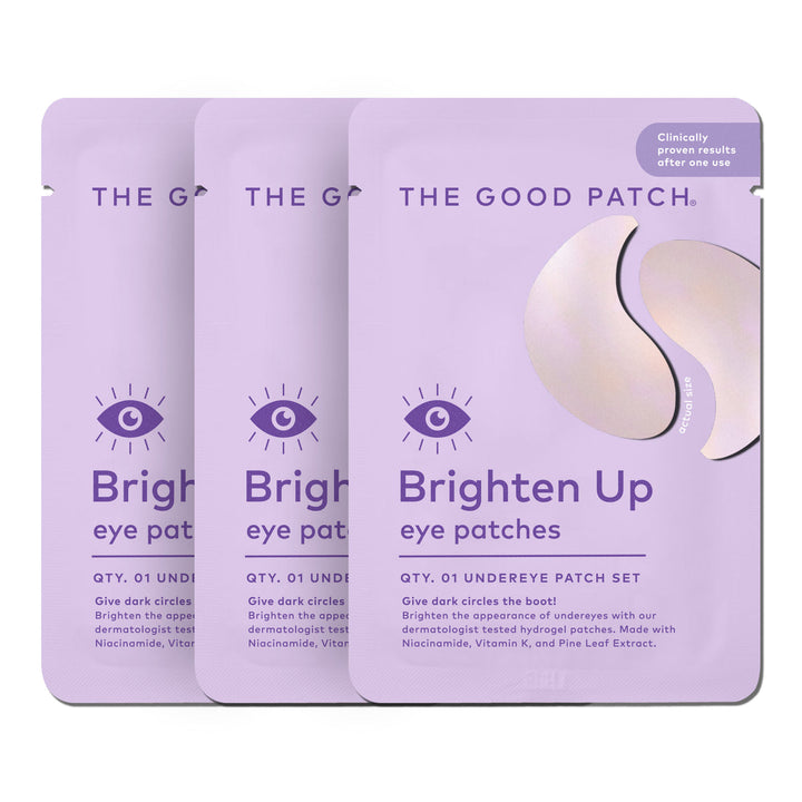 Three lavender Brighten Up Patch hydrogel under eye patch packets, each with an eye icon. Sizes available: single-use.