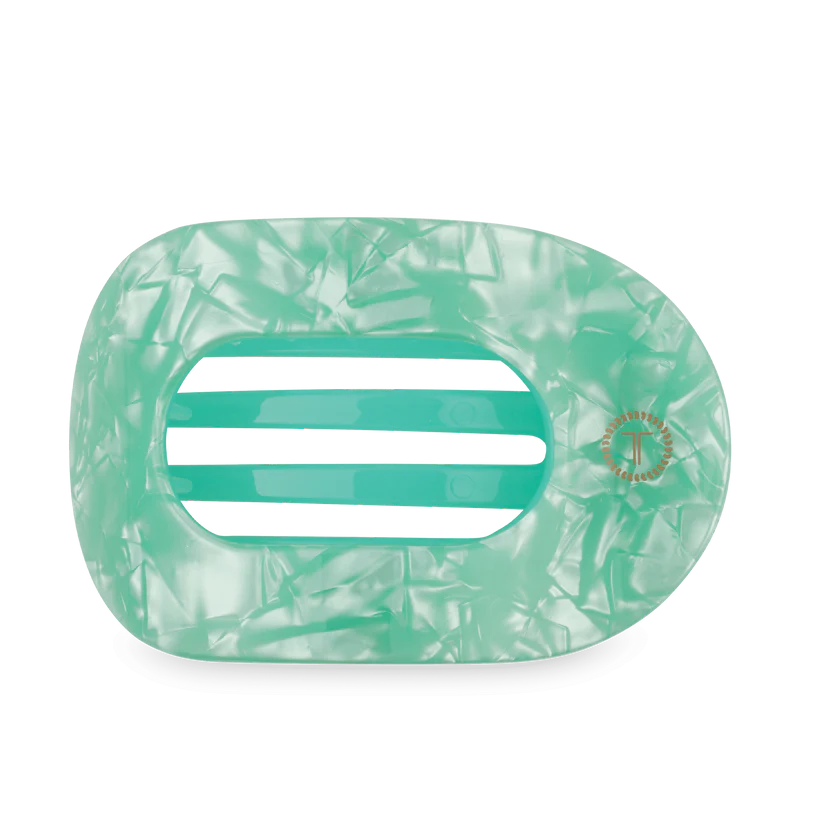 Rectangular pastel green marbled hair claw with wide horizontal openings. Available in small and large sizes.