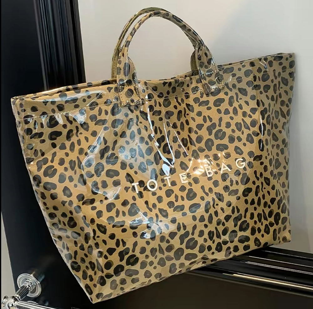Glossy Vintage Tote Bag with bold leopard print and "TOTE BAG" in white. Available in S, M, and L sizes.